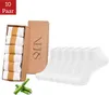 A package of white ankle socks with a box and bamboo accents. Produktbild-Vorschau
