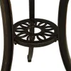 A close-up view of the base of a table, showing decorative metalwork. Náhled obrázku produktu