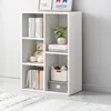 A white, open bookshelf with several shelves, displaying books, a teddy bear, a plant, and storage boxes. Náhled obrázku produktu