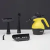 A yellow and black handheld steam cleaner with various attachments is displayed on a white surface against a black background. Náhled obrázku produktu