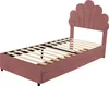 A pink upholstered bed frame with a seashell-shaped headboard and wooden slats, shown against a white background. The bed frame has two drawers underneath. Produktbild-Vorschau