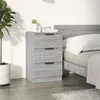 A bedside table next to a bed in a bedroom setting. Produktbild-Vorschau
