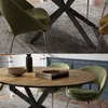A collage of two images showing dining chairs and tables. The top image shows a close-up of a green dining chair with a black table base. The bottom image shows a round wooden dining table with green chairs around it. Náhľad obrázku produktu