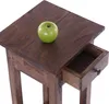 A close-up of a wooden side table with an open drawer and a green apple on top. Náhled obrázku produktu
