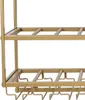 A close-up view of a gold-colored metal wine rack with two shelves and glass holders underneath. Podgląd zdjęcia produktu