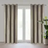 Two brown curtains are hanging on a window rod, covering a window. A plant is visible to the right. Produktbild-Vorschau