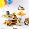 A collection of birthday cakes and decorations, featuring characters from Die Maus. Produktbild-Vorschau