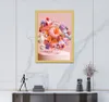A framed artwork is displayed on a marble wall above a console table with decorative items. Produktbild-Vorschau