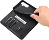 A hand is shown holding a black leather wallet-style phone case, revealing the interior card slots and a bill. Produktbild-Vorschau