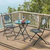A bistro set on a balcony overlooking the ocean. Produktbild-Vorschau