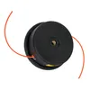 A black string trimmer head with orange trimmer line, isolated on a white background. Produktbild-Vorschau