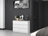 A white dresser with decorative items on top, placed against a dark gray wall. Anteprima dell’immagine prodotto