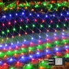 A net of colorful LED lights is draped over grass and bushes, likely for outdoor decoration. Produktbild-Vorschau