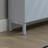 Close-up view of the bottom of a gray cabinet with metal legs on a wood-look floor. Náhľad obrázku produktu