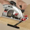 A person is using a Skil circular saw to cut a piece of wood. Náhľad obrázku produktu