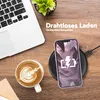 A phone case is shown charging on a wireless charger next to a laptop and a cup of coffee. Produktbild-Vorschau