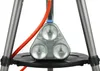 Close-up of the base of a camping grill with a tripod stand. Produktbild-Vorschau