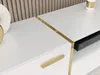 A close-up view of a white, high-gloss TV lowboard with gold accents and a drawer handle. Náhľad obrázku produktu