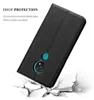 A black phone case is shown in a dynamic pose, appearing to be dropped onto a cracked surface, illustrating its protective qualities. Náhled obrázku produktu