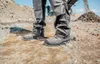 A person wearing work boots on a construction site. Anteprima dell’immagine prodotto