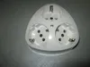A white electrical adapter with three sockets is placed on a gray surface. Anteprima dell’immagine prodotto