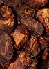 A close-up, overhead view of dried tomatoes. Produktbild-Vorschau