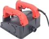 A black and red power tool with two handles is shown against a white background. Podgląd zdjęcia produktu