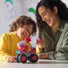 A mother and son are playing with a toy fire truck. Produktbild-Vorschau
