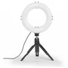 A white ring light is mounted on a black tripod, with a black cord extending to the left. Produktbild-Vorschau