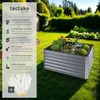 A raised garden bed filled with plants in a backyard setting, with informational text and gloves on the left side. Náhled obrázku produktu