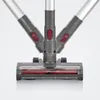 Close-up view of a vacuum cleaner head and its handle mechanism. Produktbild-Vorschau