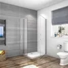 A modern bathroom with a glass shower enclosure, tiled walls, and wooden flooring. Produktbild-Vorschau
