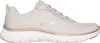 A side view of a beige Skechers sneaker with gold accents. Voir les images du produit