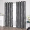 A pair of dark gray curtains with a white wavy pattern hanging in front of a window. Produktbild-Vorschau