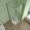 A corner shower enclosure with glass doors and silver handles, set in a bathroom with light green walls and a wooden floor. Produktbild-Vorschau