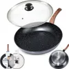 A frying pan with a glass lid, shown from multiple angles, including a close-up of the pan's bottom and a smaller inset image of the pan with its packaging. Produktbild-Vorschau