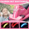 A young girl wearing headphones is shown enjoying music while sitting in a pink electric ride-on car. The image also displays close-ups of the car's LED lights in different colors. Náhľad obrázku produktu
