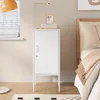 A white metal nightstand is placed next to a bed in a bedroom. Voir les images du produit