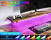 A desk setup with a monitor, keyboard, and controller, illuminated by RGB LED strips. Anteprima dell’immagine prodotto