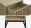 A collage showing two close-up views of a wooden nightstand with a fluted drawer front and black metal legs. Produktbild-Vorschau