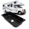 A black RV sink is shown in the foreground with a white RV in the background. Podgląd zdjęcia produktu