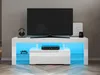 A white TV stand with LED lighting and a television on top.