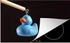 KitchenYeah© Herdabdeckplatte Blaue Bade-Ente auf schwarzem Produktbild-Vorschau 1