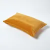 A single mustard yellow pillow is shown on a white background. Produktbild-Vorschau