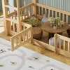 A child's bed with a play area underneath, featuring toys and a rug. Podgląd zdjęcia produktu