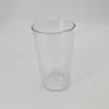 A clear plastic measuring cup is shown against a plain background. Náhled obrázku produktu
