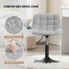 A grey chenille swivel chair with a black base is shown in a room setting, with close-up insets highlighting its features. Produktbild-Vorschau