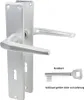 A silver-colored door handle set with a keyhole and a separate key. Produktbild-Vorschau