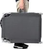 A person is holding a folded gray lounge chair. Produktbild-Vorschau