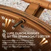 Close-up of a fire pit grate with text overlay describing its features. Produktbild-Vorschau